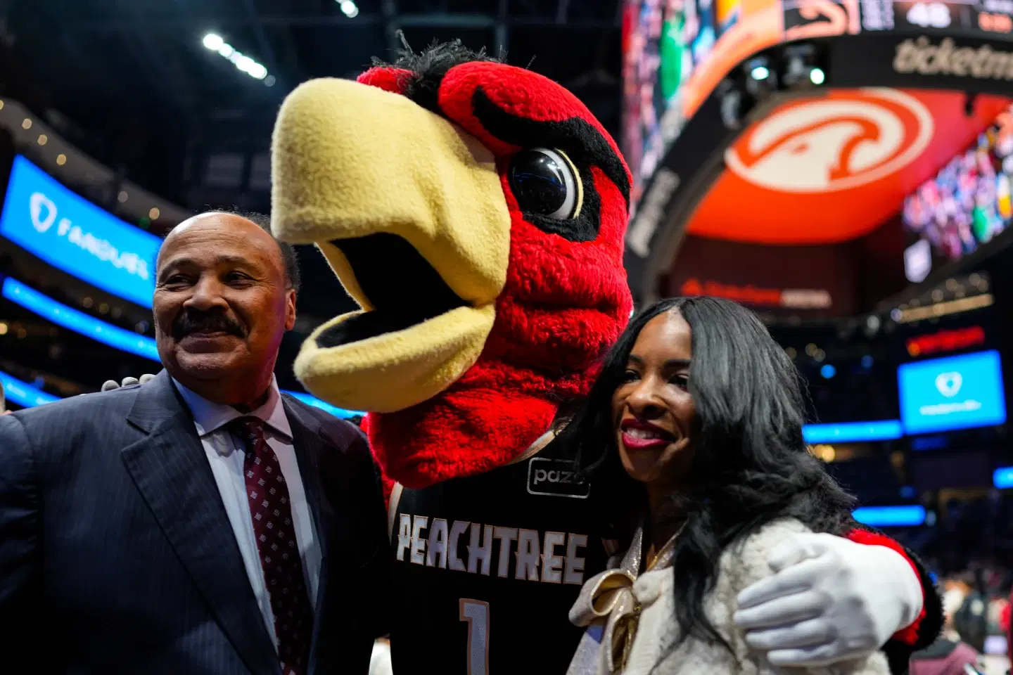 Martin Luther King III, and his wife Andrea Waters King pose for a photo during the second half of an NBA basketball game between the Atlanta Hawks and the Milwaukee Bucks, Monday, Jan. 19,2026, in Atlanta. (AP Photo/Mike Stewart)